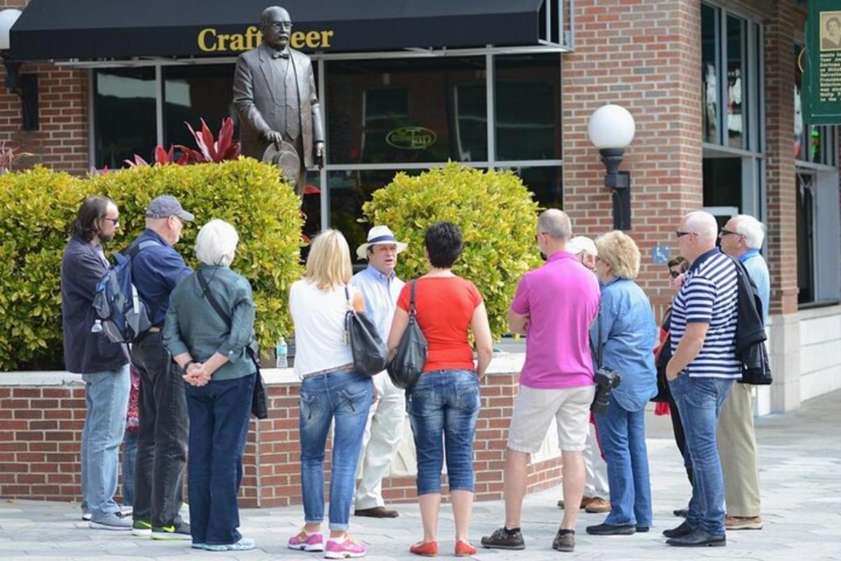 a group of people standing in front of a statue