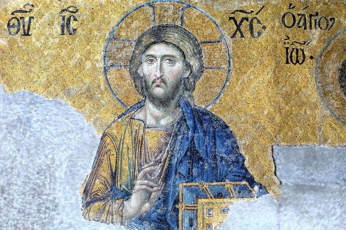 un mosaic d'un home sostenint la unció