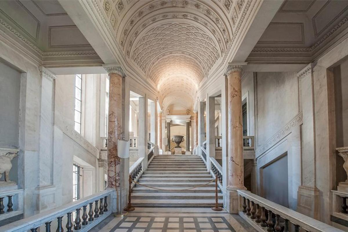a hallway with a staircase in a building