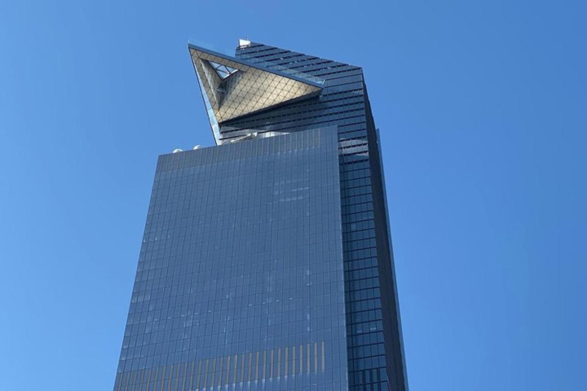 a tall building with a blue sky in the background