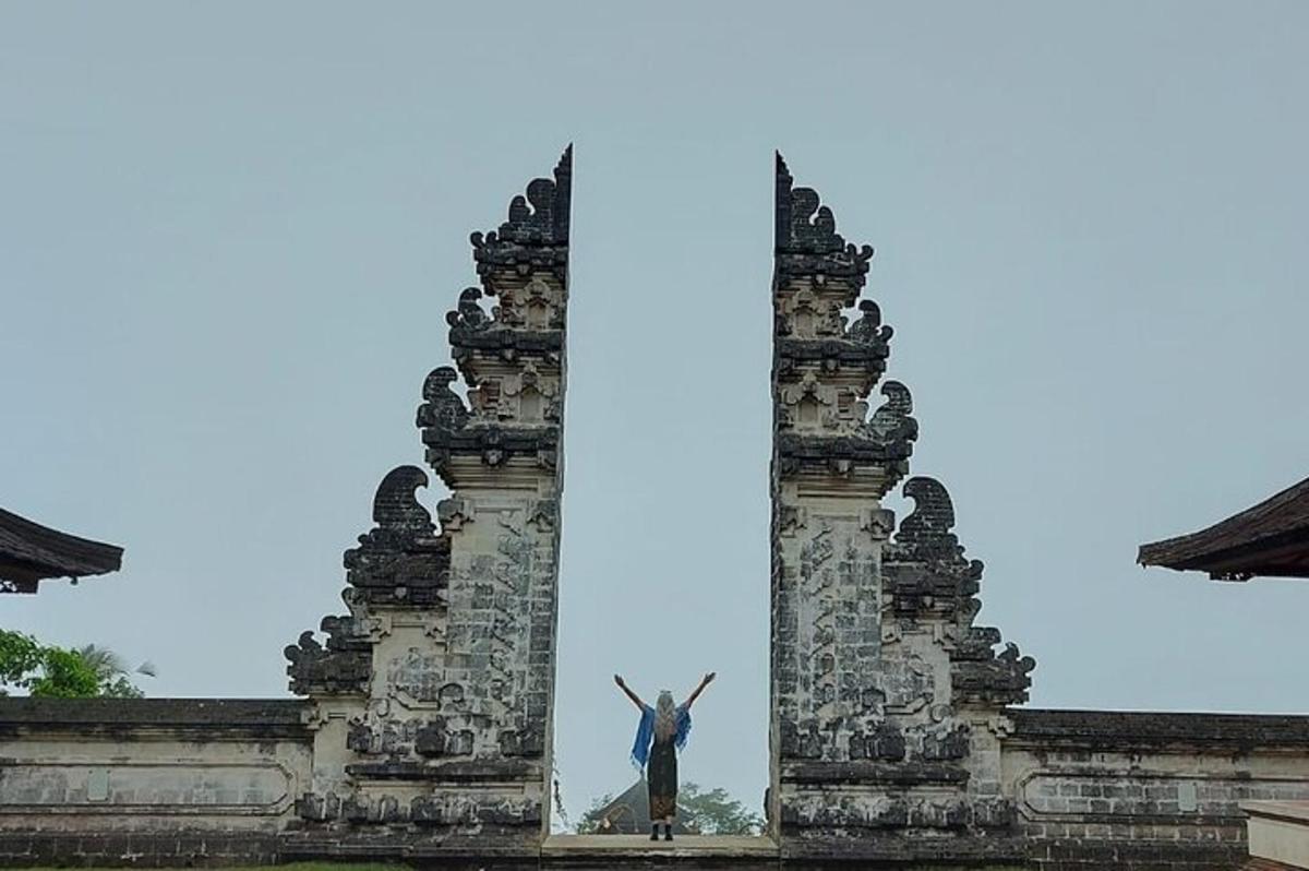 a statue of a man standing on top of a building