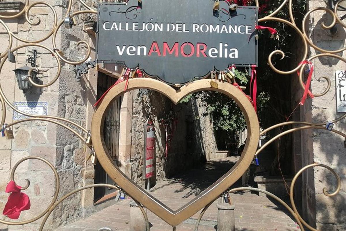 a heart shaped sign on the side of a building