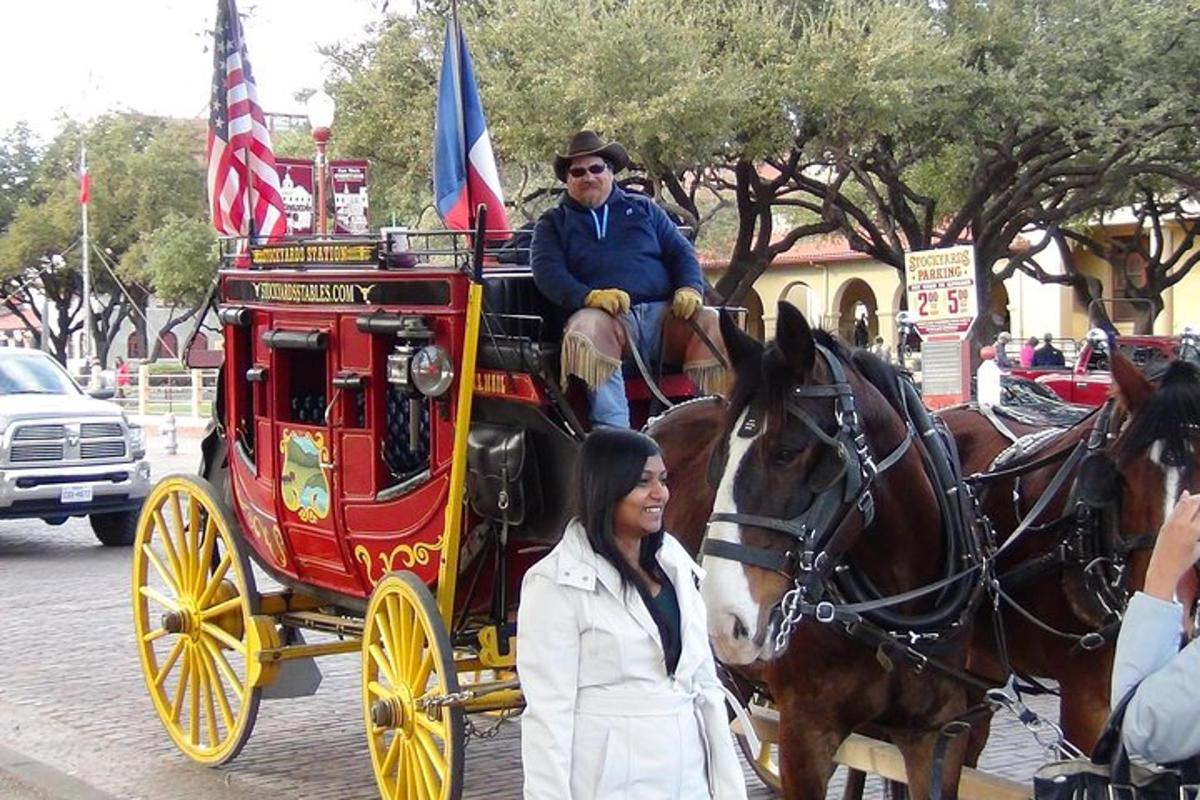 a man is riding in a horse drawn carriage