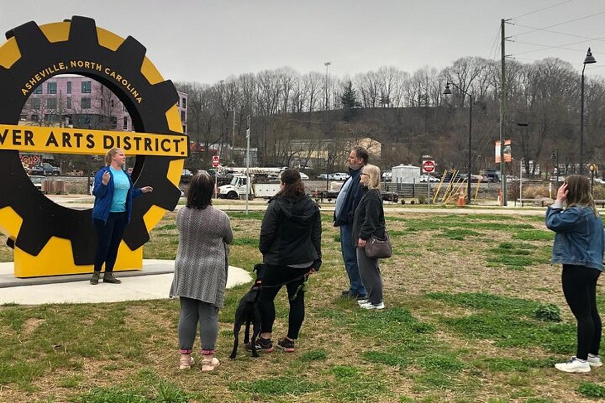 a group of people standing around a sign with a dog