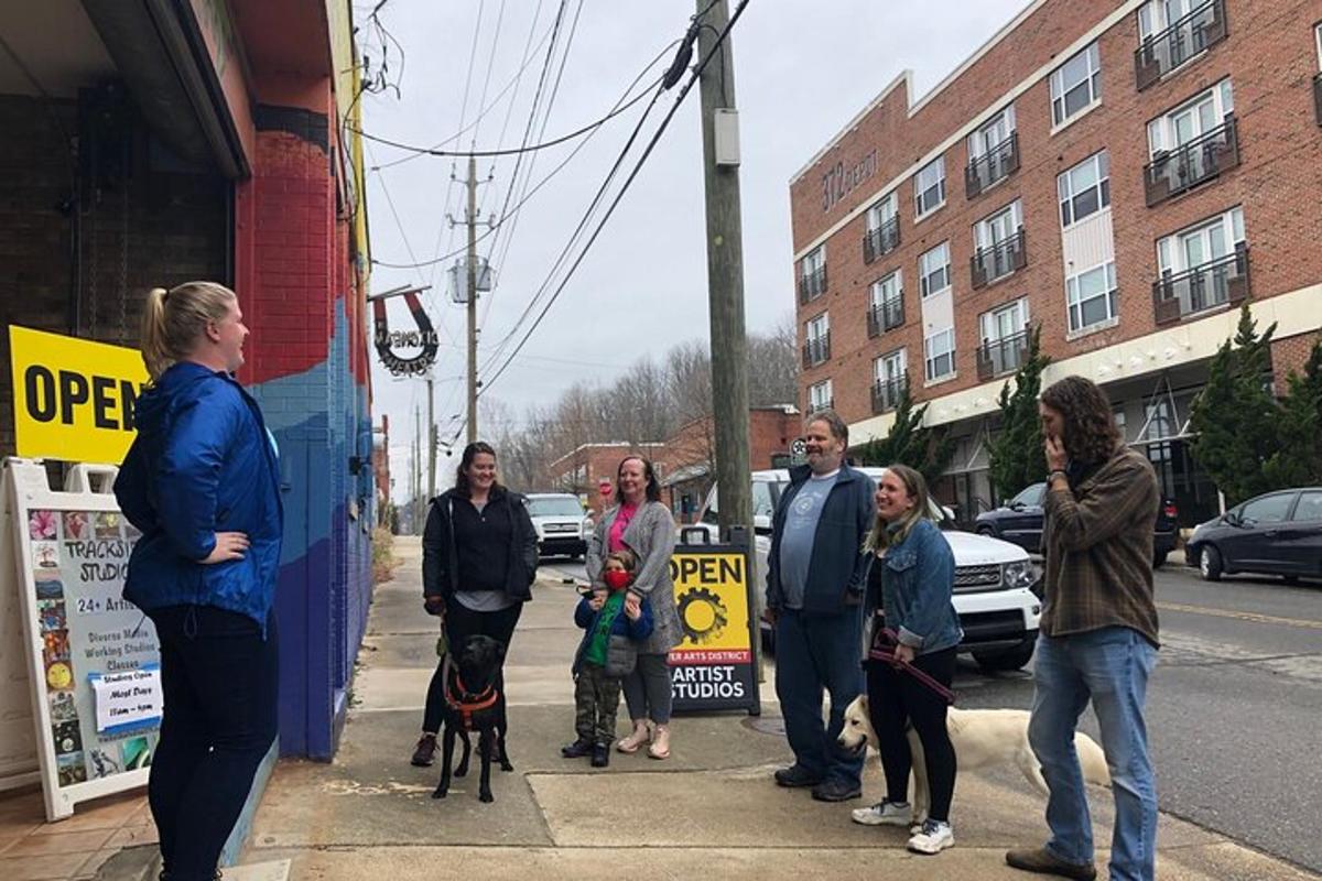 a group of people standing on a sidewalk