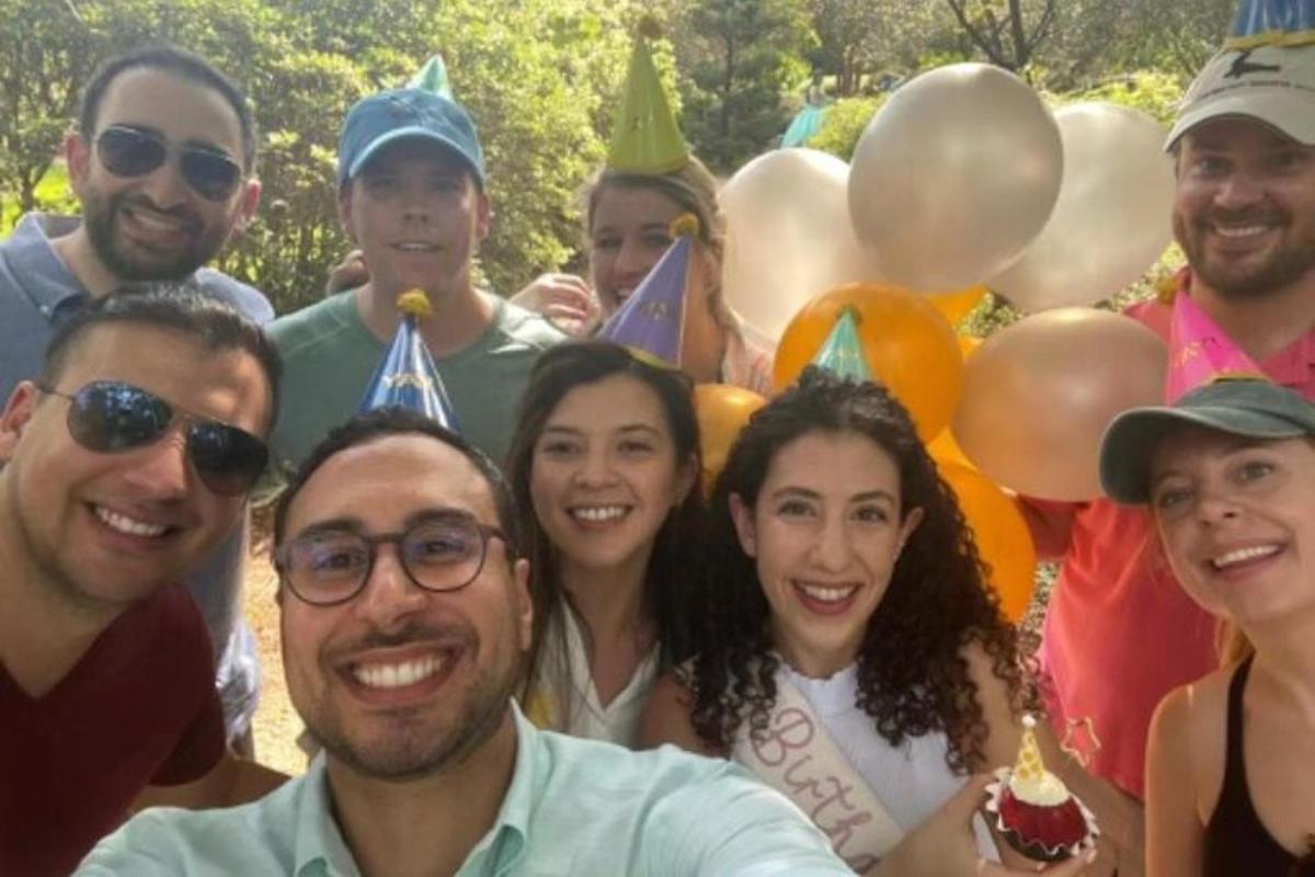 a group of people posing for a picture at a party