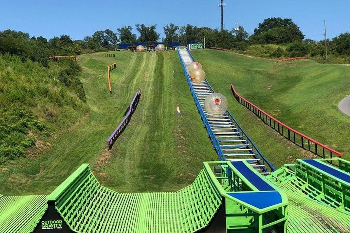 a playground with a fake train on a hill