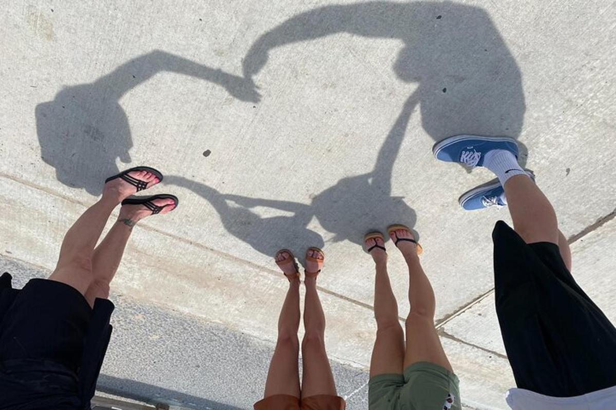 two people standing on the ground with their shadows