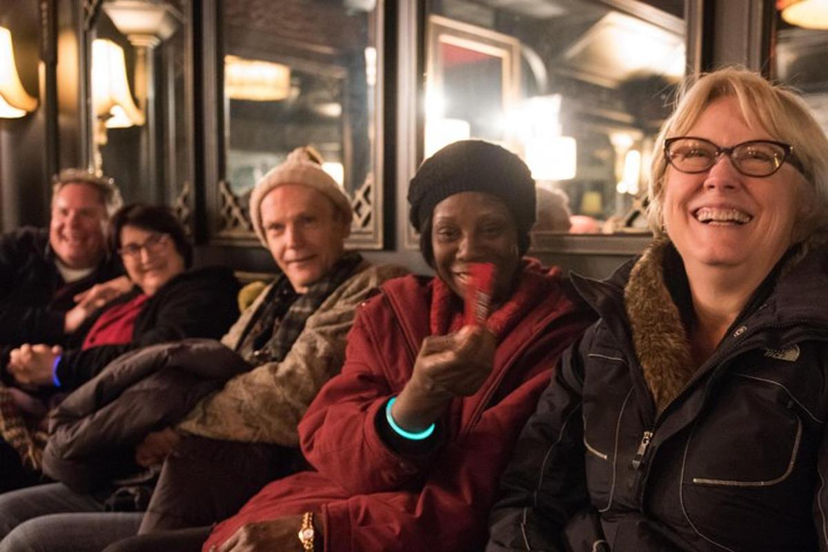 a group of people sitting on a train