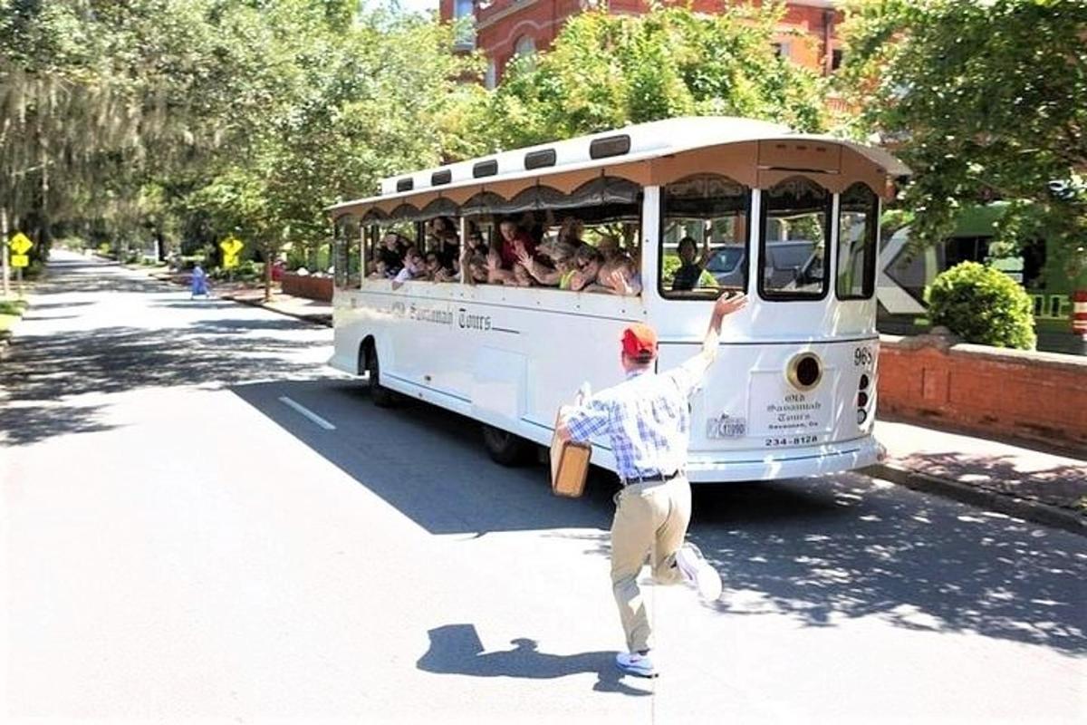 a man running towards a bus full of people