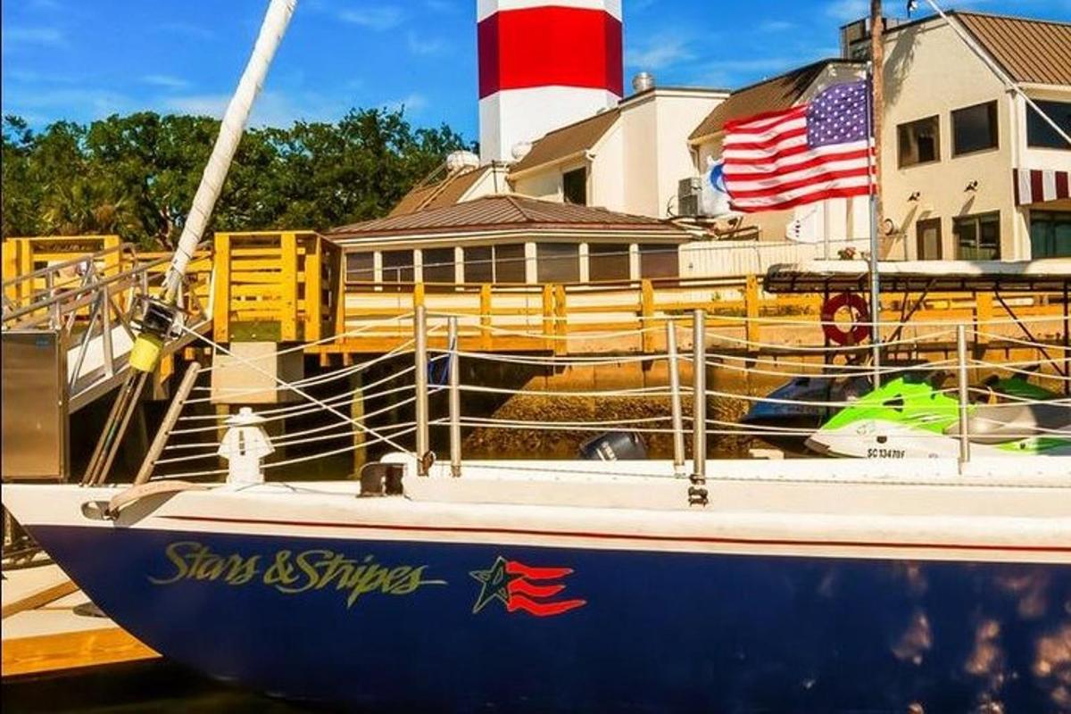 a boat is docked in front of a house