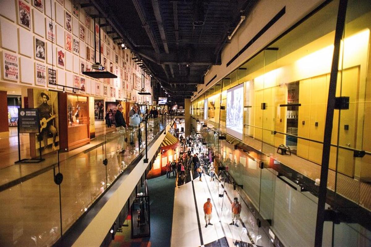 a group of people walking through a shopping mall