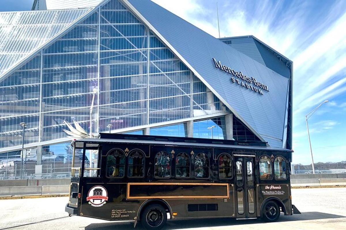 a black bus parked in front of a building