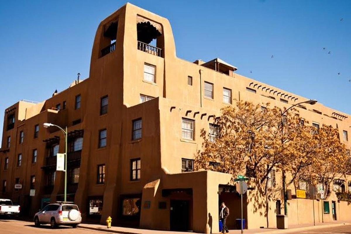a large brick building on the corner of a street