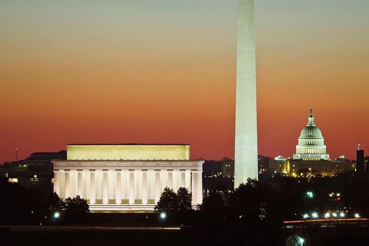 the capitol building and the washington monument at night