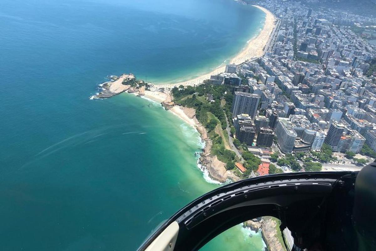 a view of a beach and the ocean from an airplane