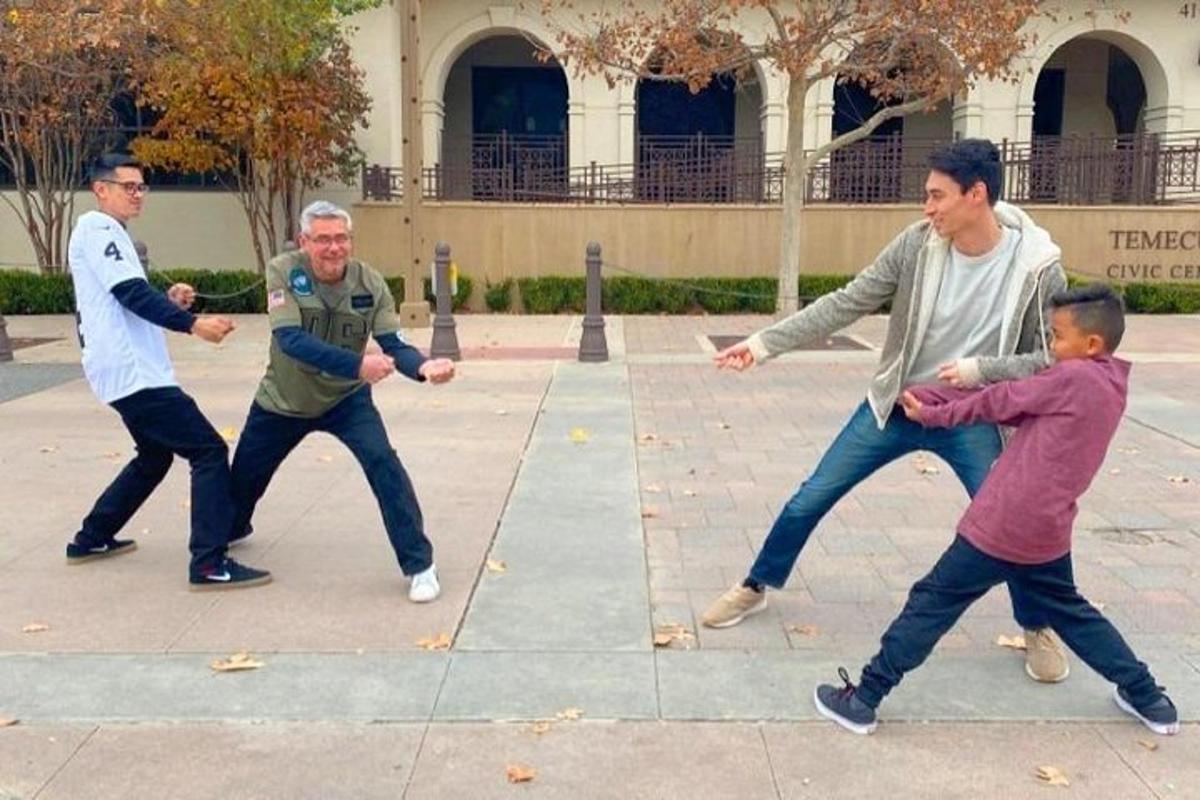 a group of men playing a game with a child