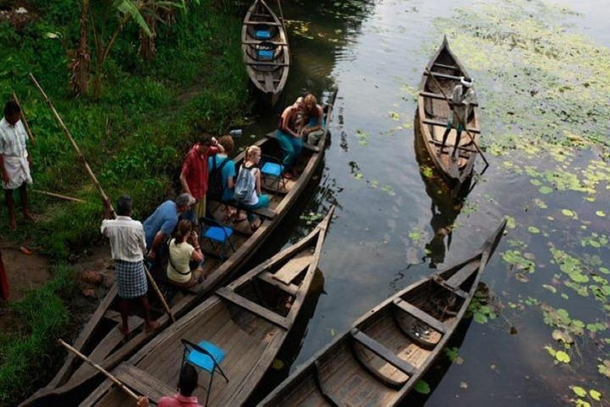 a group of people riding in boats in the water