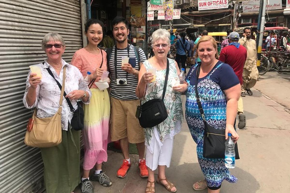 a group of people posing for a picture on a street