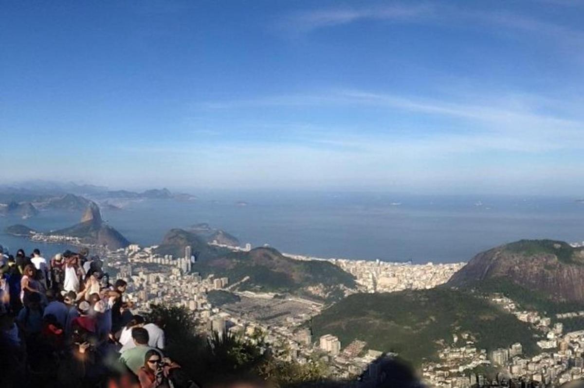 a group of people standing on top of a mountain