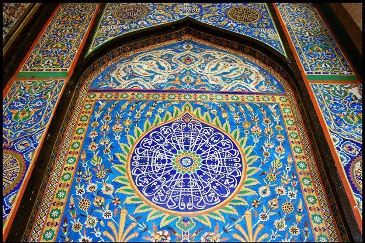 a blue wall with a design on it