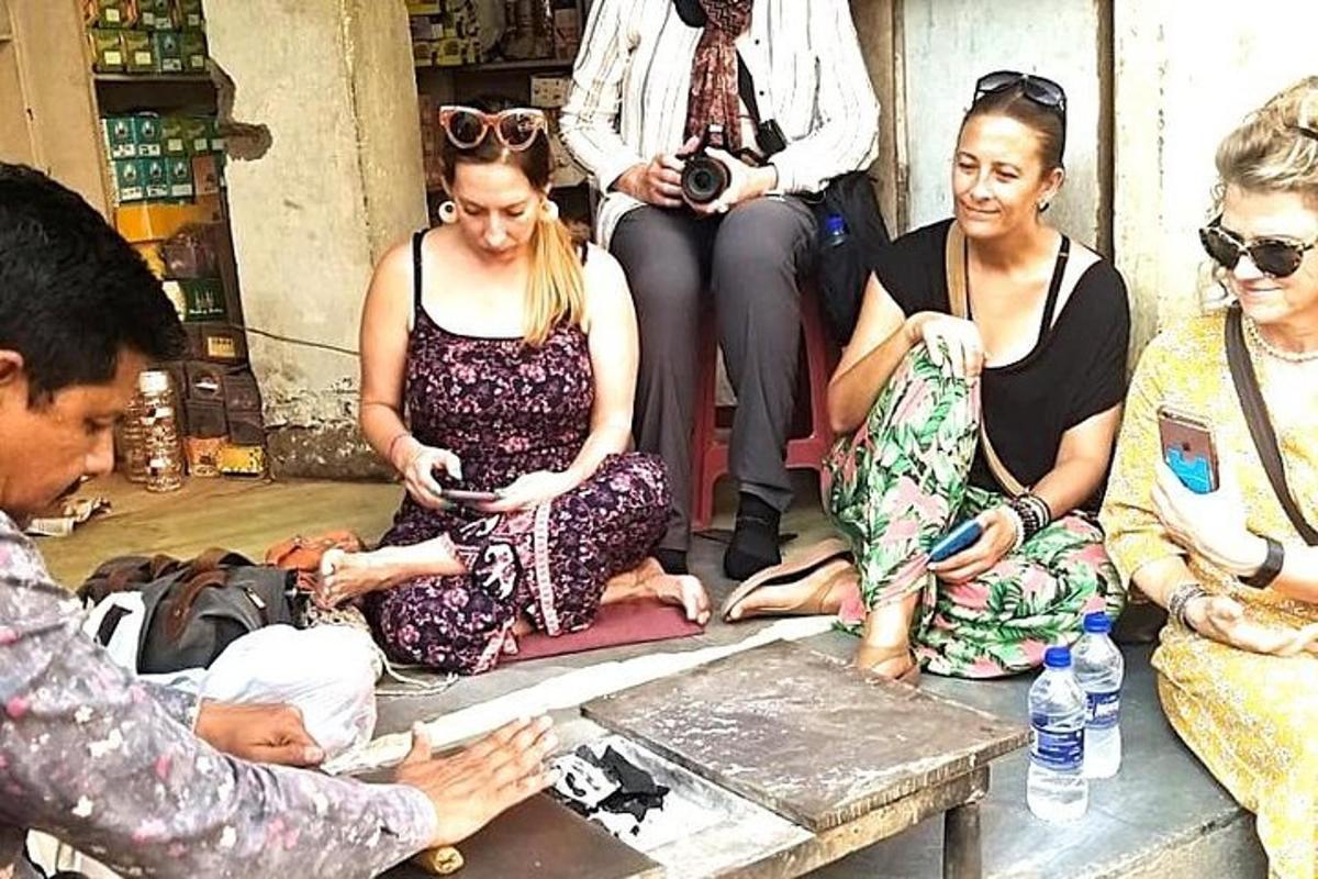 a group of women sitting on the floor with a soldier