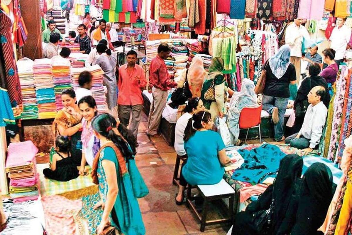 a group of people in a market in a store