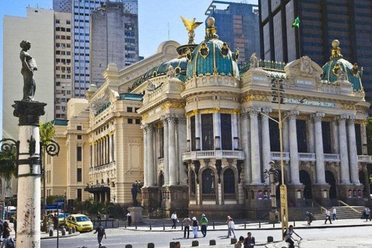a large building with people walking in front of it