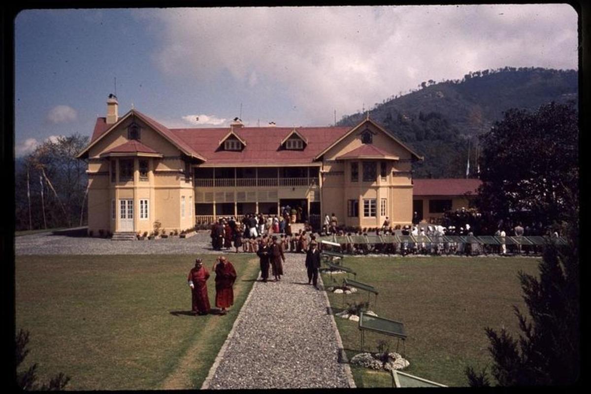 a group of people standing in front of a large building
