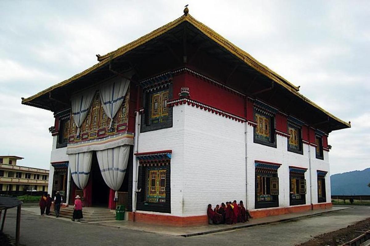 a large white building with a peaked roof