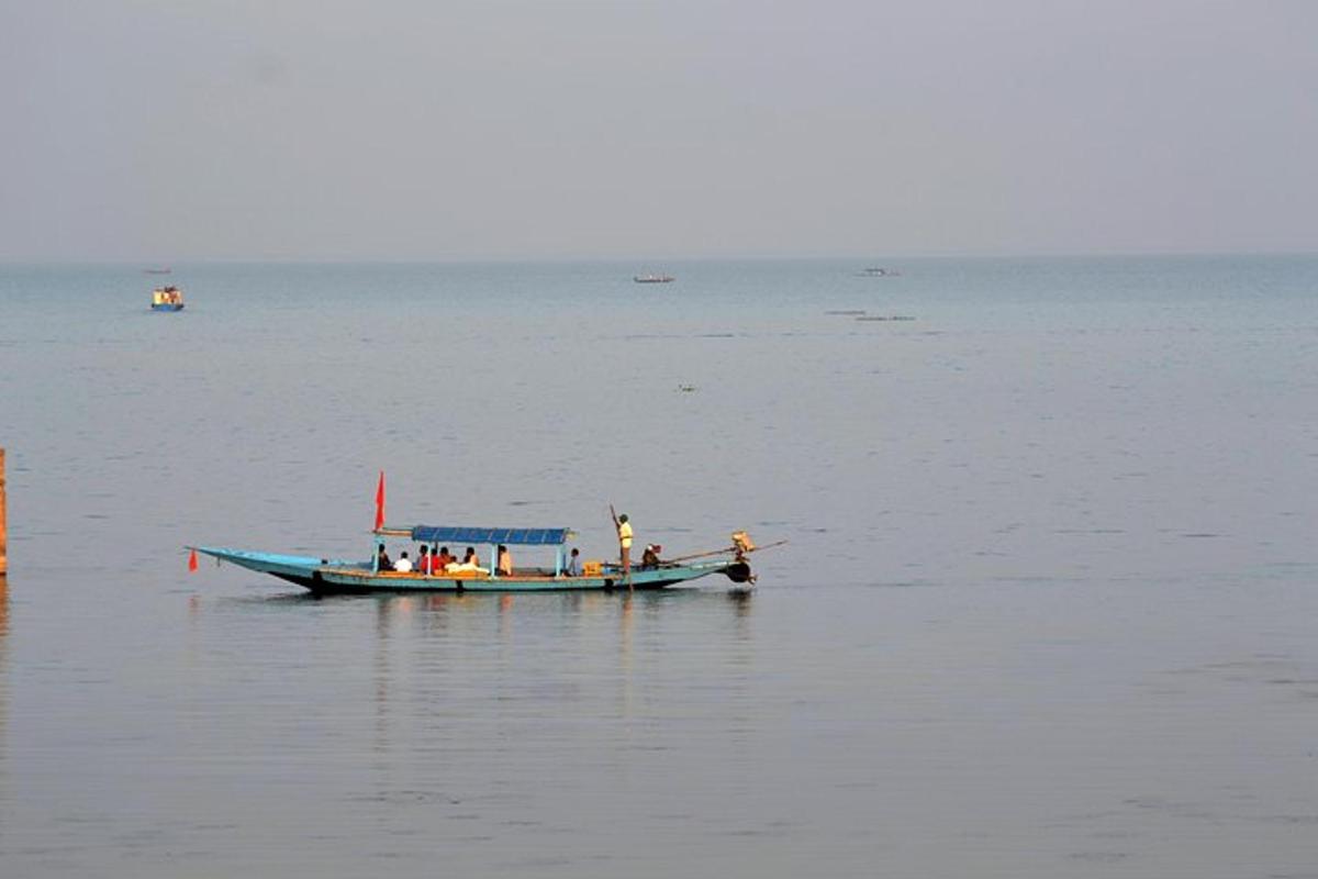 a small boat in the middle of the water