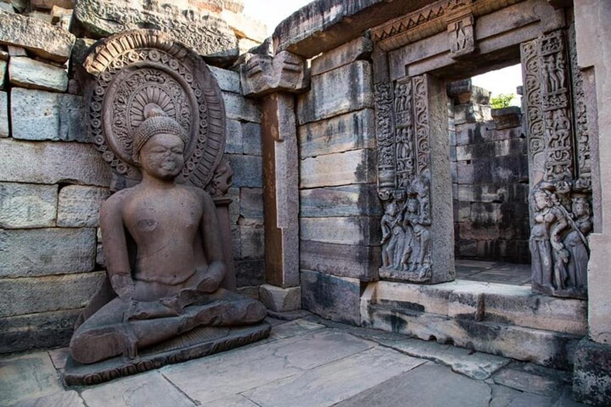 a statue sitting in the corner of a building