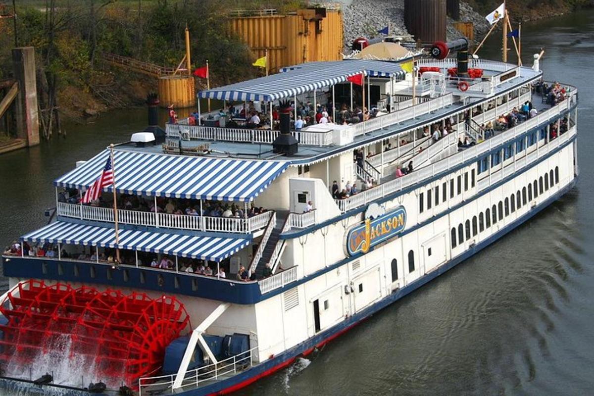 a large boat with people on it on the water