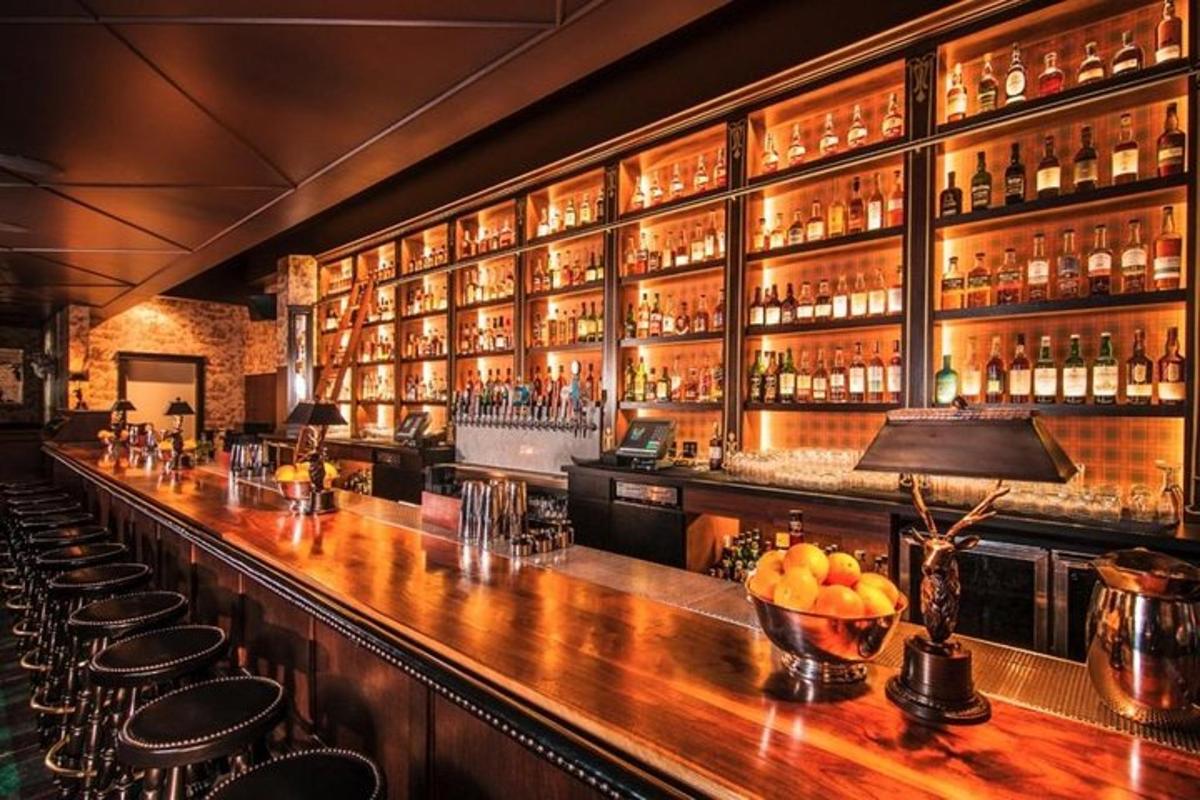 a bar with a lot of bottles of alcohol
