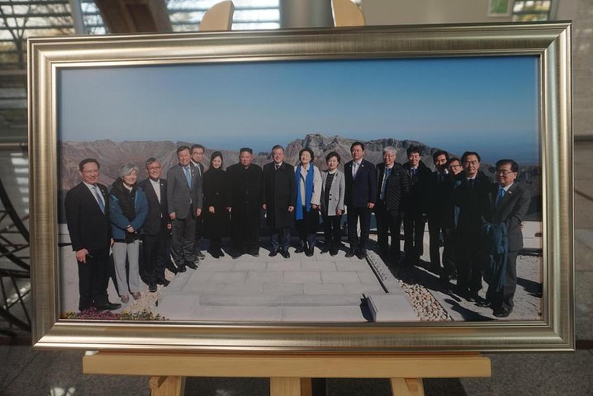 a framed picture of a group of men in suits