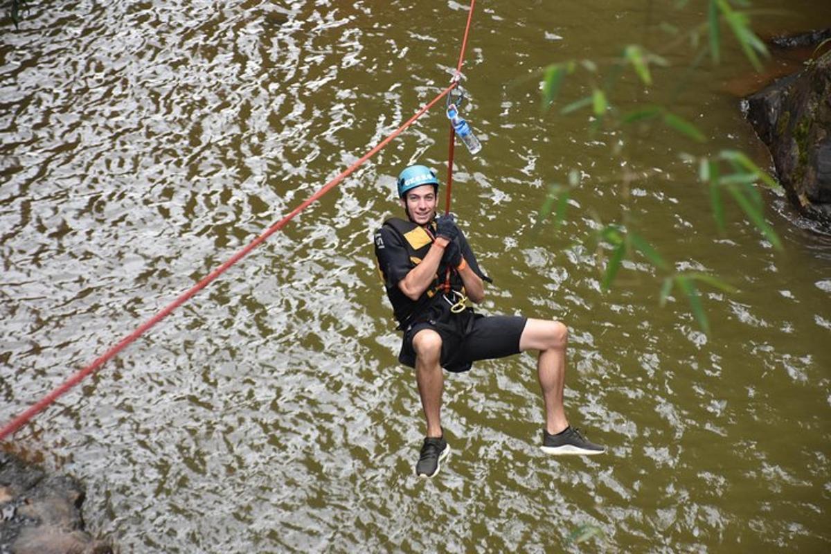 a man is on a rope in the water
