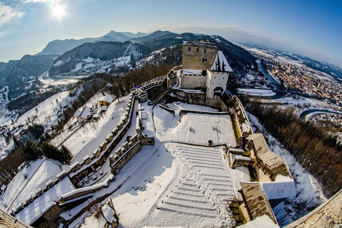 a building on top of a snow covered mountain