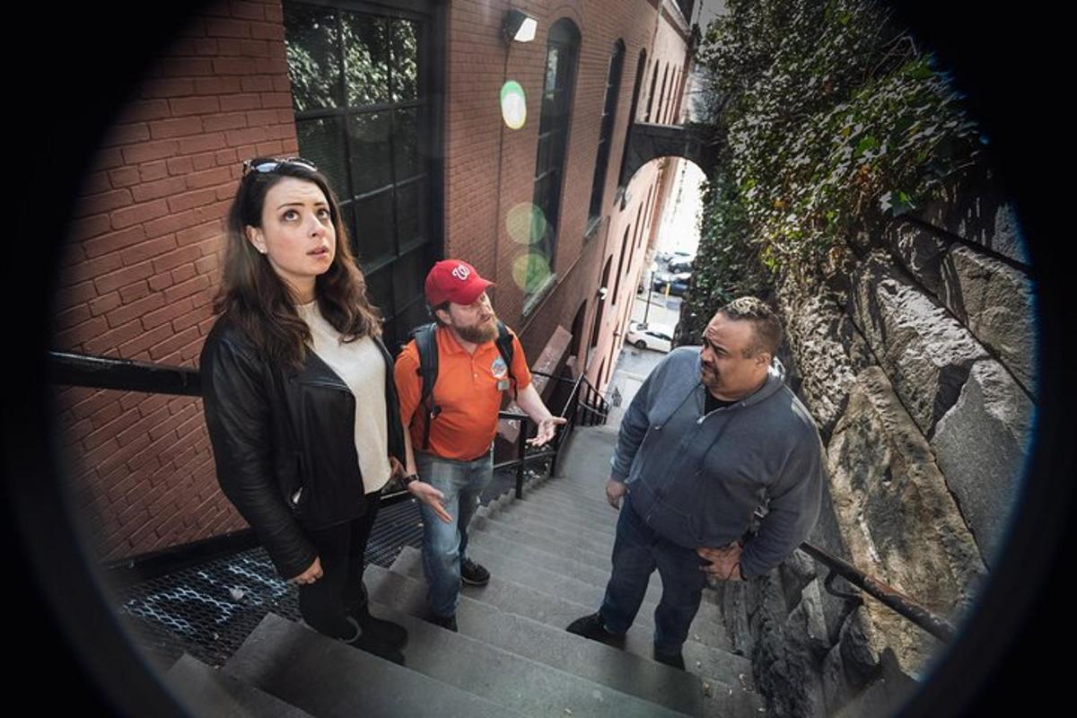 a group of people walking down some stairs