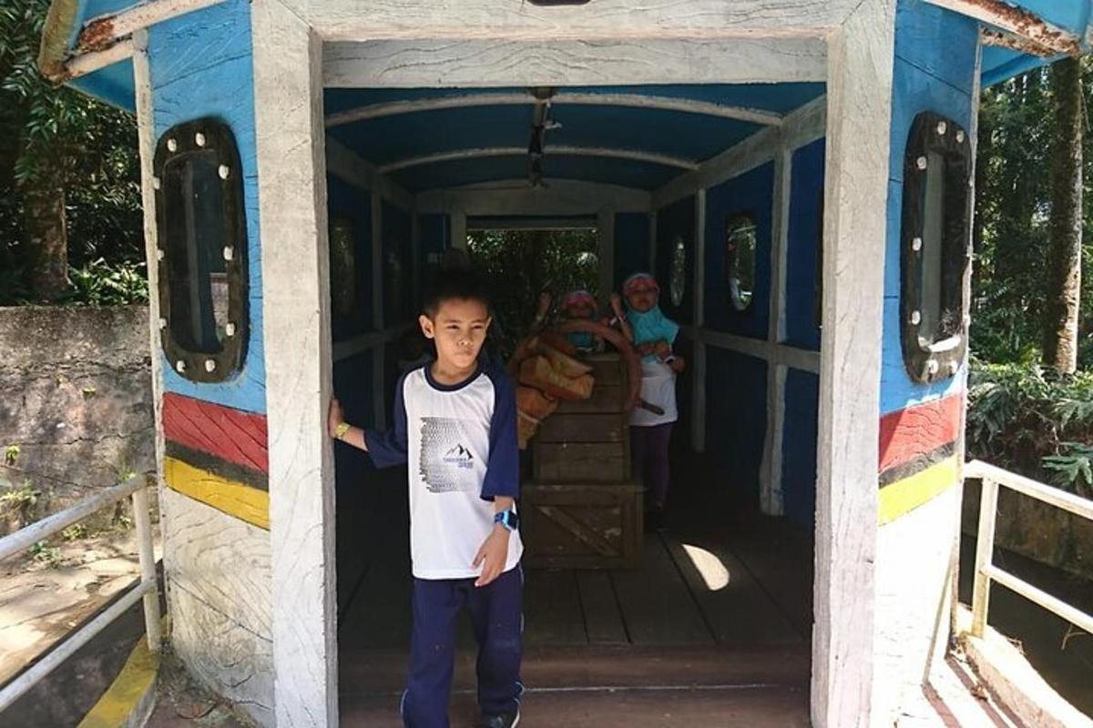 a young boy standing in the doorway of a train