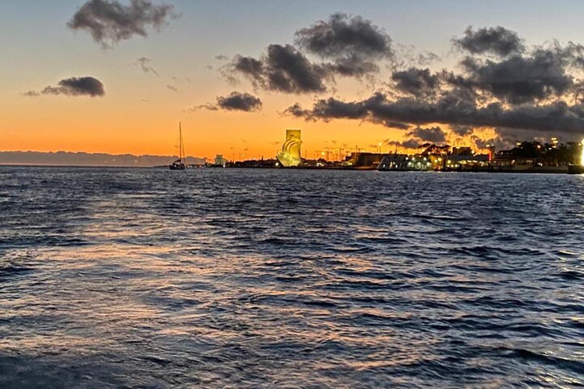 a view of the ocean at sunset from a boat