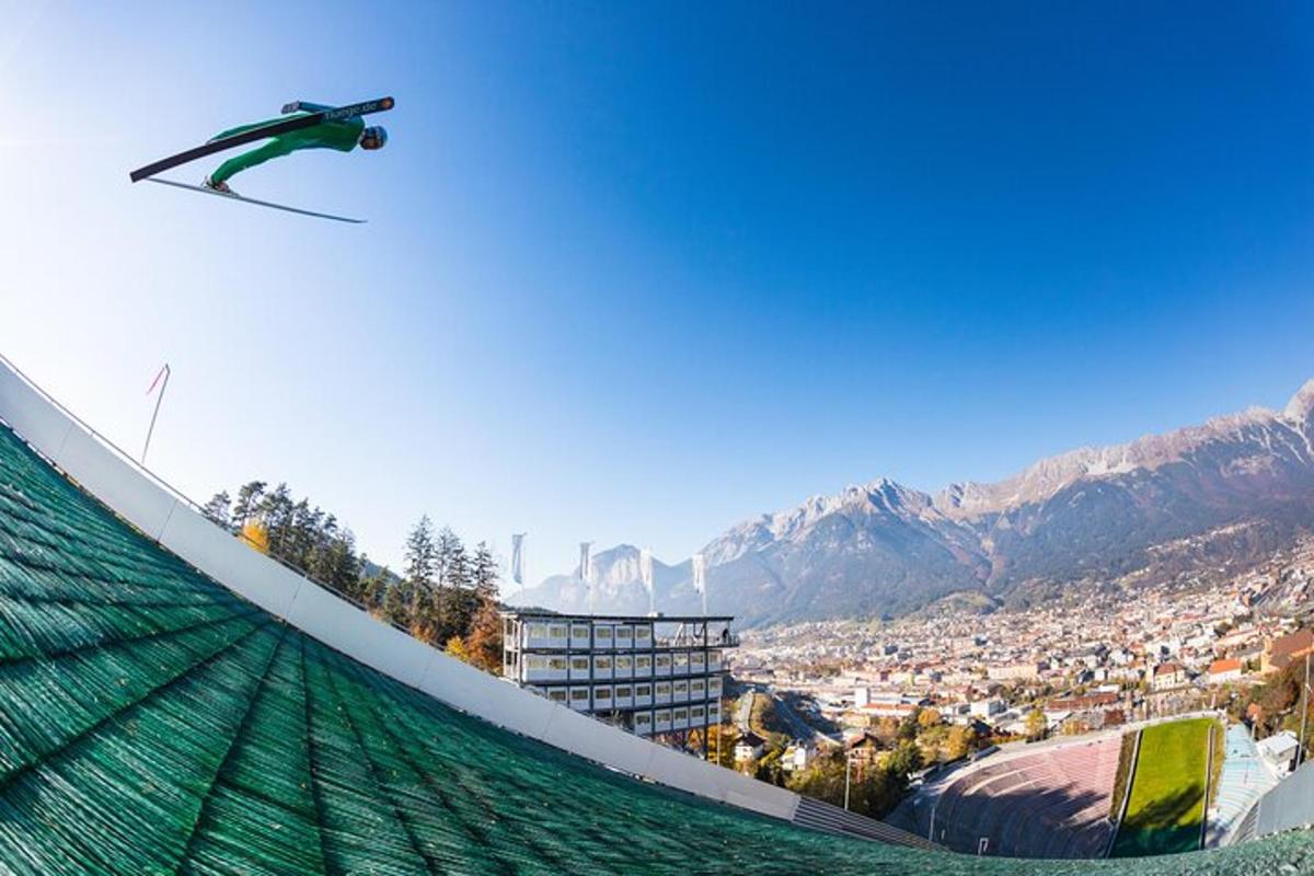 a person on skis jumping off of a ramp