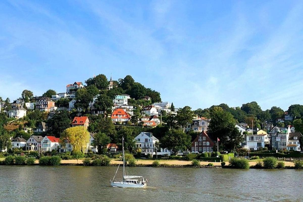a boat floating on the water in front of houses