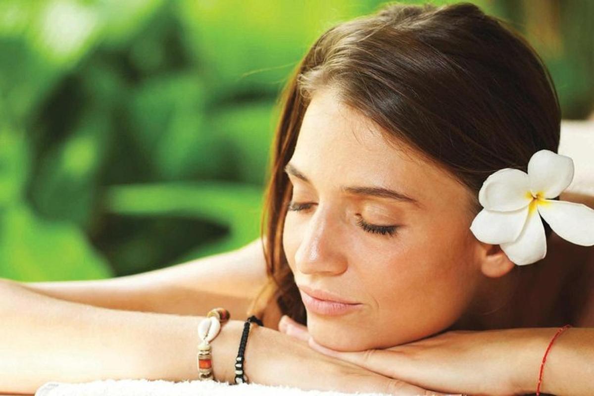 a young woman with a flower in her hair