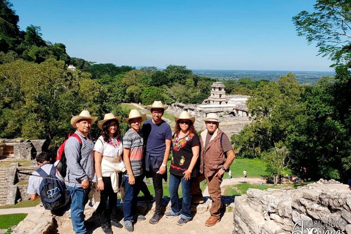 a group of people posing for a picture at a temple