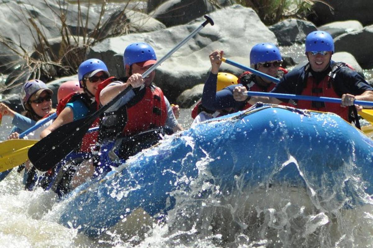 a group of people on a raft in a river