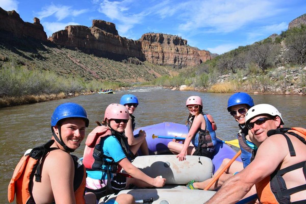 a group of people on a raft in the river