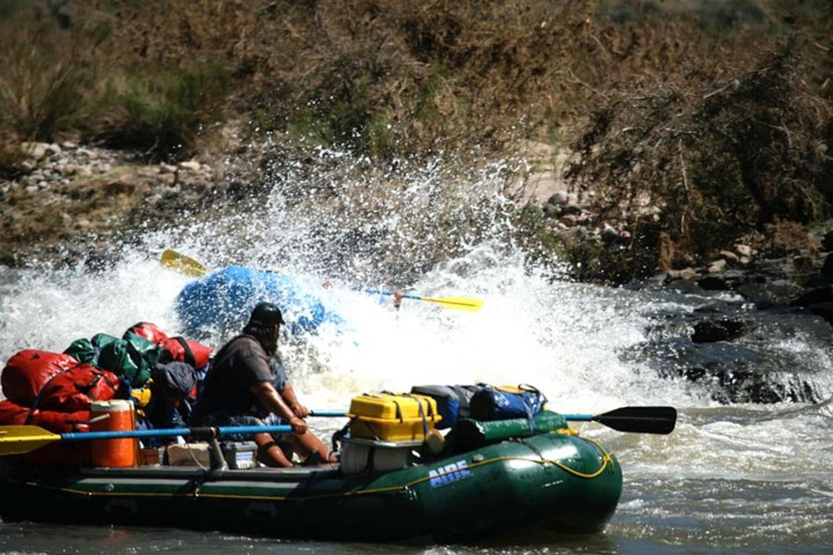 a group of people on a raft in the water