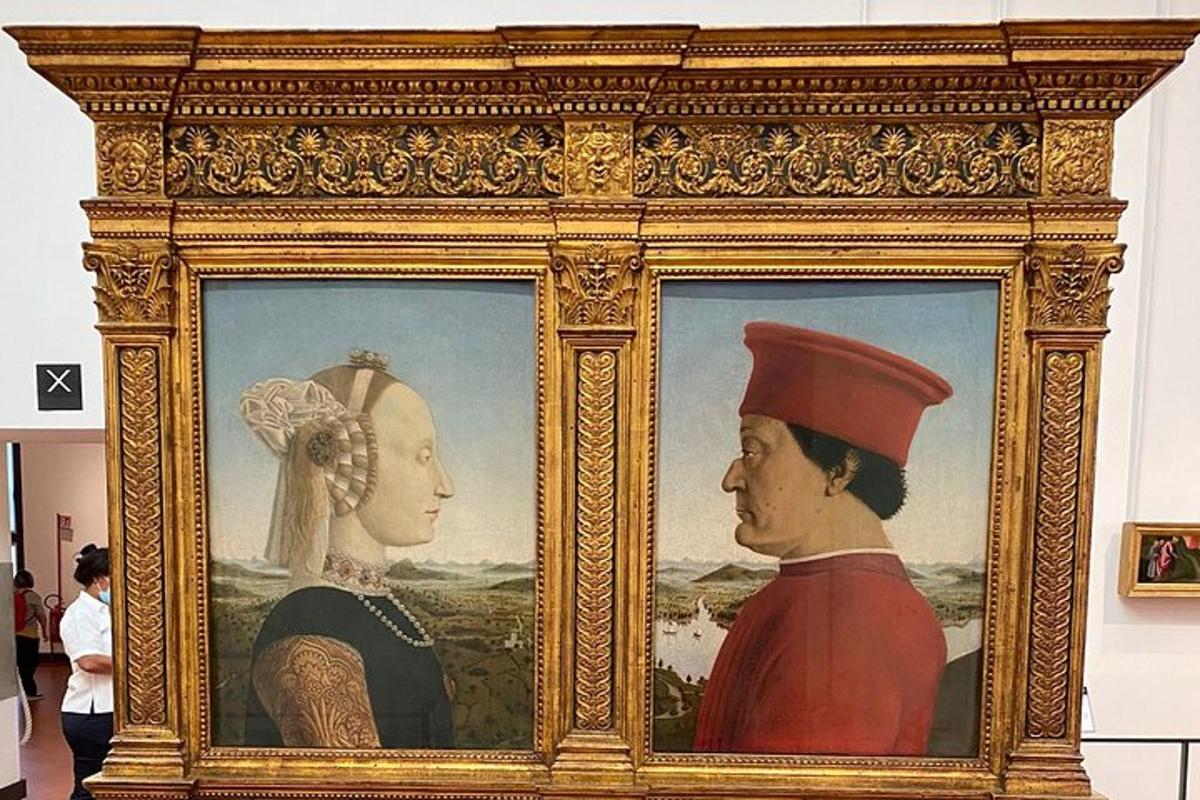 a framed painting of a man and a woman