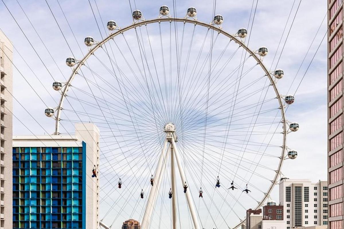 a large ferris wheel in the middle of a city