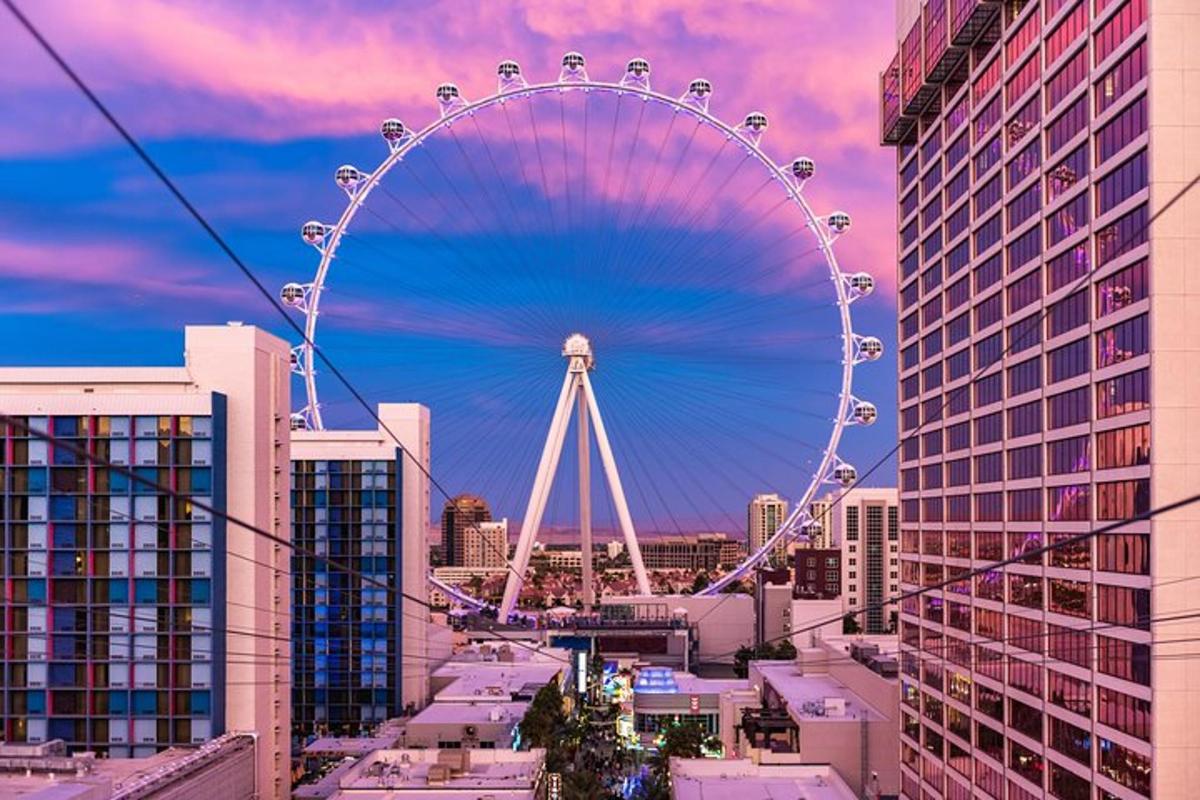 a large ferris wheel in a city with tall buildings